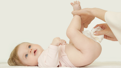 Parent gently cleaning their baby's delicate skin with a babylux natural bamboo baby wipe
